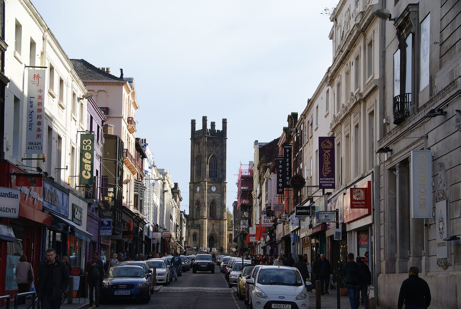 Bold Street in Liverpool looking towards St Luke's Church with shops lining both sides