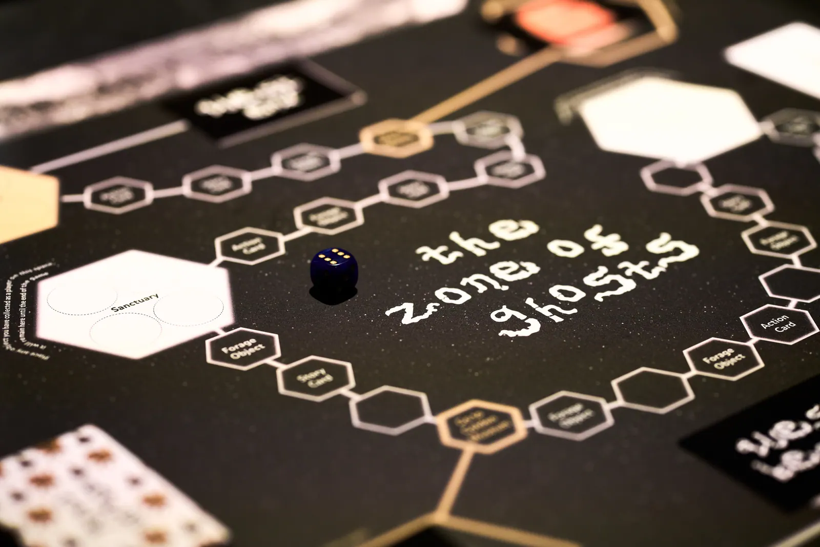 Close view of The Zone of Ghosts board, showing a winding route, hexagonal spaces and game pieces