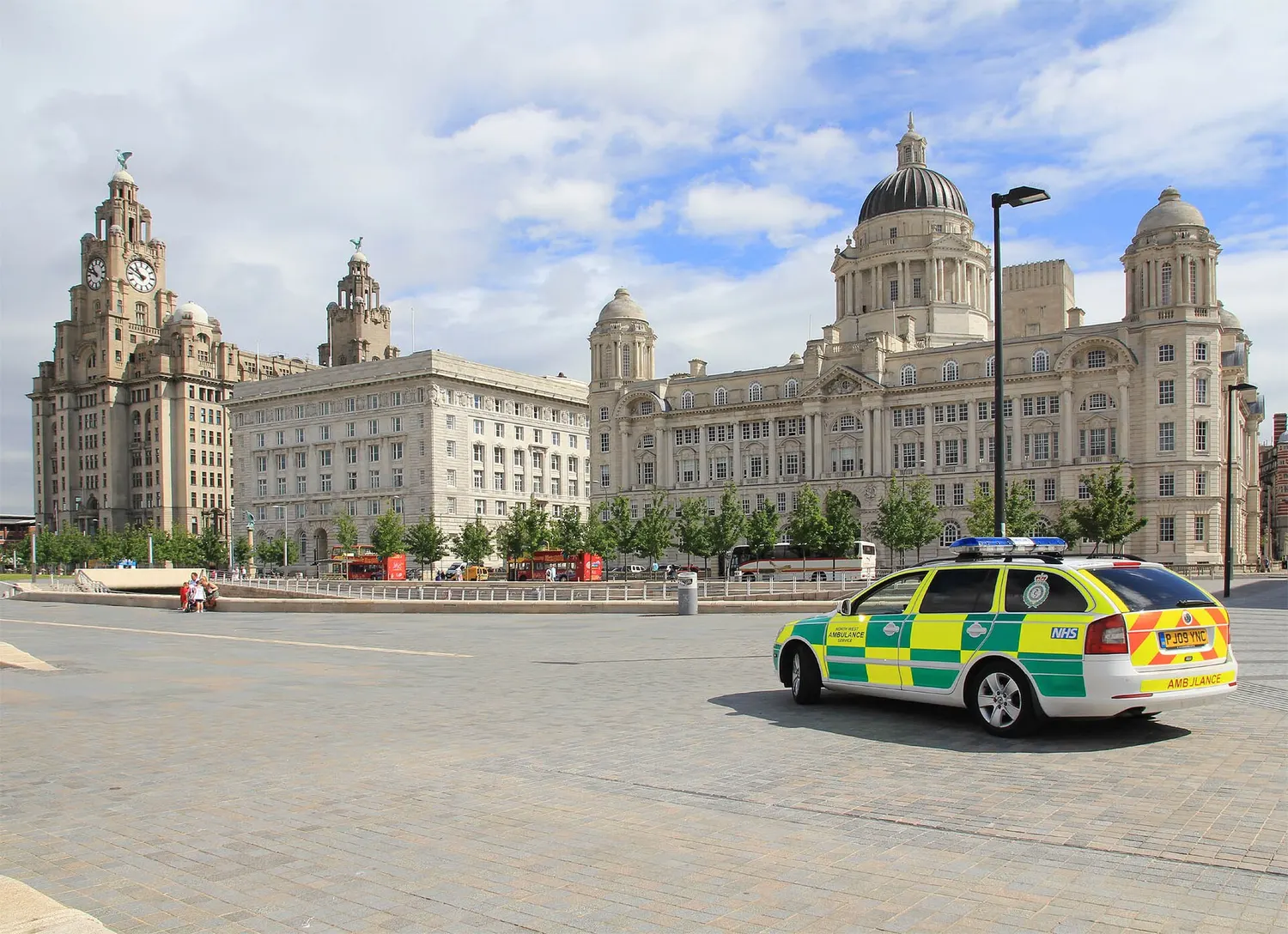 The Three Graces at Liverpool's Pier Head seen from across the water, with the Royal Liver Building at the centre