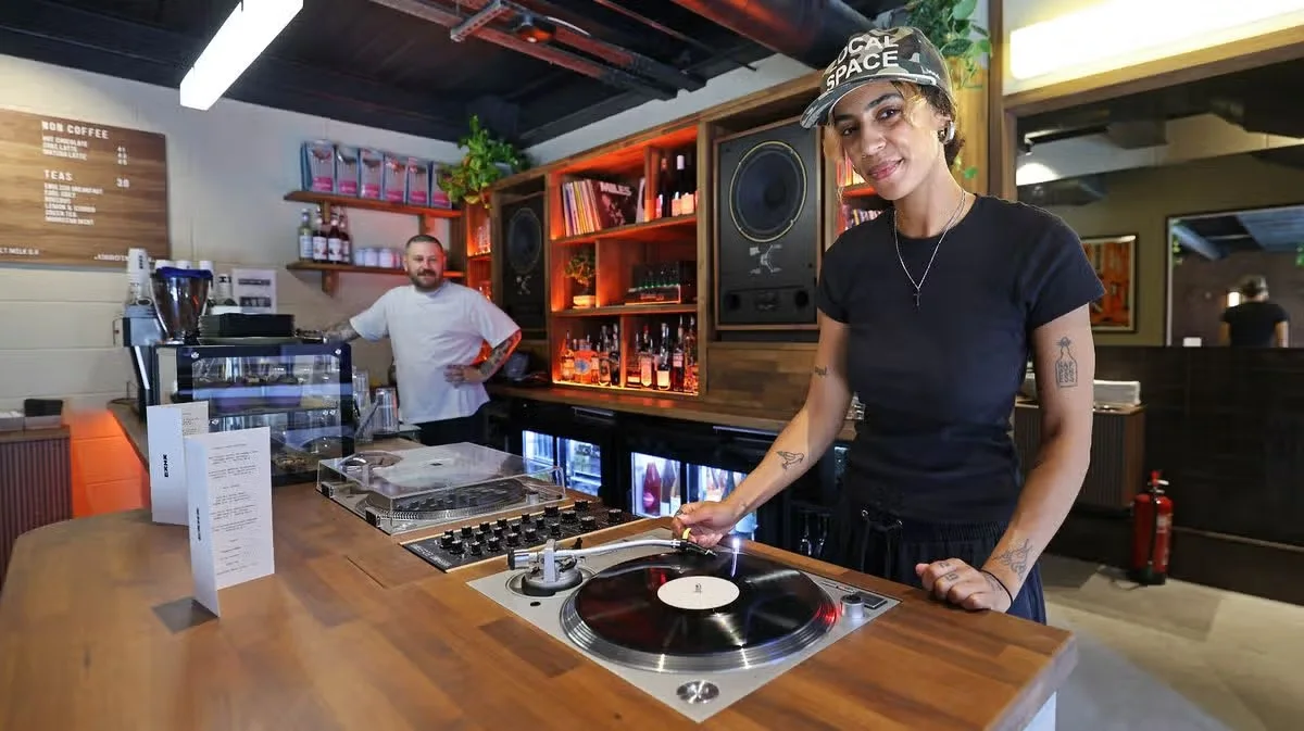 Audiophile turntable recessed into the wooden bar counter at Kiku Hifi