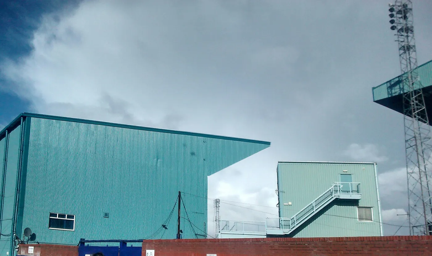 The blue-painted exterior of the main stand at Prenton Park in Birkenhead