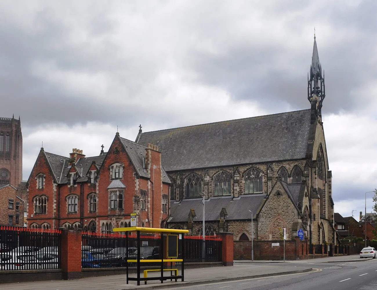 The Gothic stone exterior and spire of St Vincent de Paul Church on Hardy Street